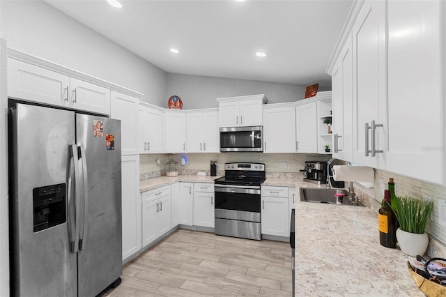 122 Seville Rd, Auburndale, FL 33823 - kitchen with stainless steel appliances, open shelves, backsplash, white cabinets, and recessed lighting
