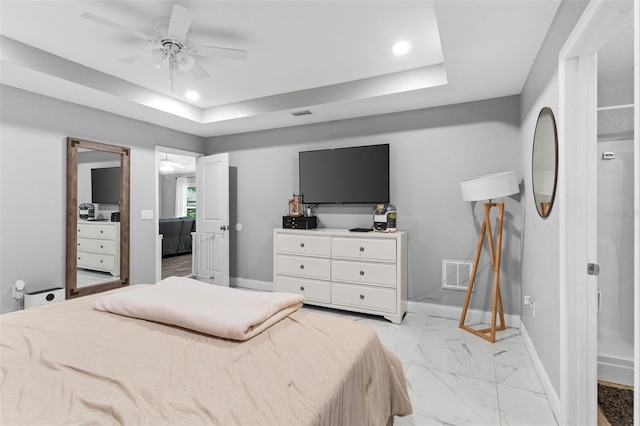 122 Seville Rd, Auburndale, FL 33823 - bedroom featuring light marble finish flooring, baseboards, a tray ceiling, recessed lighting, and ceiling fan