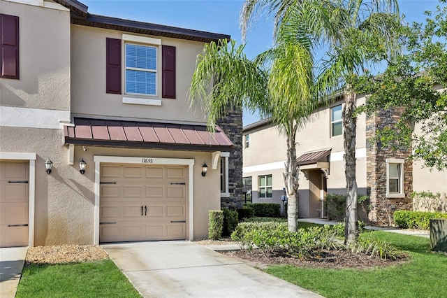 11632 Castine St, New Port Richey, FL 34654 - townhome / multi-family property featuring a standing seam roof, stucco siding, and stone siding