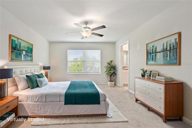 11632 Castine St, New Port Richey, FL 34654 - carpeted bedroom with baseboards, connected bathroom, and a ceiling fan