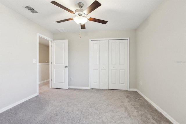 11632 Castine St, New Port Richey, FL 34654 - unfurnished bedroom featuring carpet floors, baseboards, a closet, and a ceiling fan
