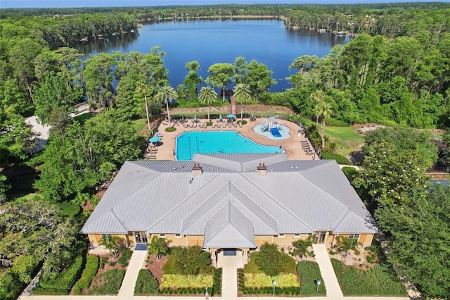 11632 Castine St, New Port Richey, FL 34654 - aerial view of property and surrounding area with a nearby body of water, a pool area, and a heavily wooded area