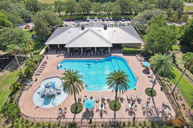11632 Castine St, New Port Richey, FL 34654 - community pool featuring a patio and view of scattered trees