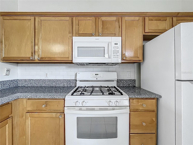 1131 Turtle Lake Ct, Ocoee, FL 34761 - kitchen featuring white appliances, decorative backsplash, and brown cabinets
