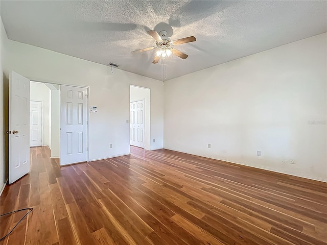 1131 Turtle Lake Ct, Ocoee, FL 34761 - unfurnished bedroom with wood finished floors, a textured ceiling, and a ceiling fan