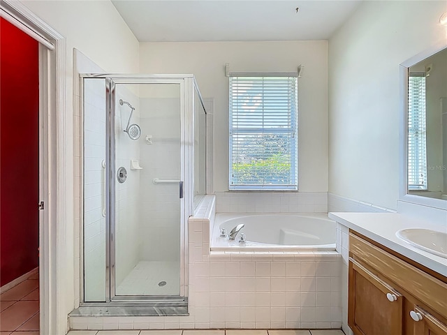 1131 Turtle Lake Ct, Ocoee, FL 34761 - full bathroom with vanity, a shower stall, a garden tub, and tile patterned flooring