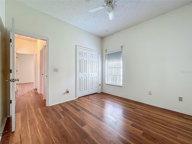 1131 Turtle Lake Ct, Ocoee, FL 34761 - unfurnished bedroom featuring a textured ceiling, wood-type flooring, a closet, baseboards, and ceiling fan
