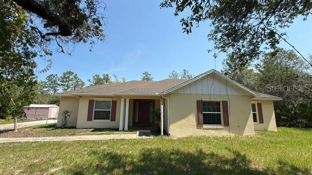 30965 E Thyme Ave, Eustis, FL 32736 - ranch-style house featuring a front yard and stucco siding