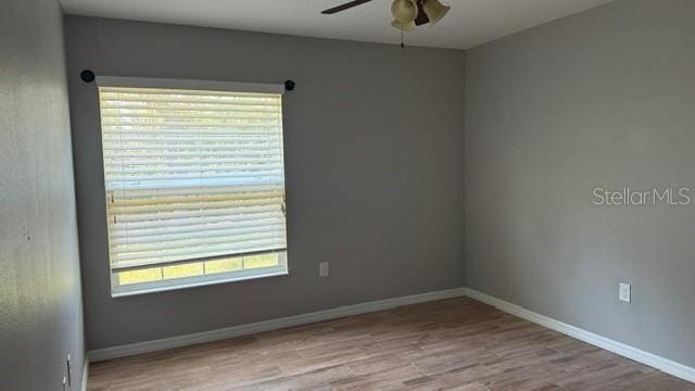30965 E Thyme Ave, Eustis, FL 32736 - spare room with ceiling fan, wood finished floors, and baseboards