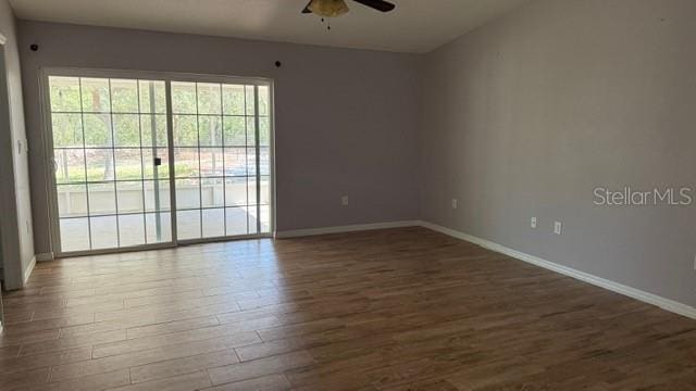 30965 E Thyme Ave, Eustis, FL 32736 - empty room with dark wood-style floors, ceiling fan, and baseboards
