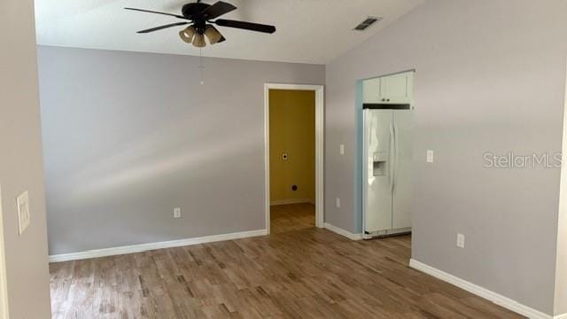 30965 E Thyme Ave, Eustis, FL 32736 - spare room featuring ceiling fan, wood finished floors, baseboards, and lofted ceiling