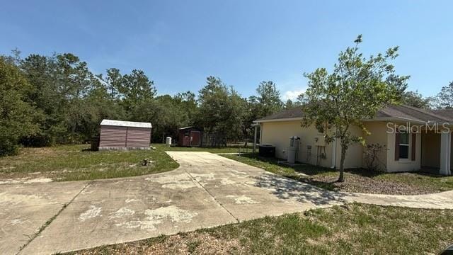 30965 E Thyme Ave, Eustis, FL 32736 - view of patio / terrace featuring driveway
