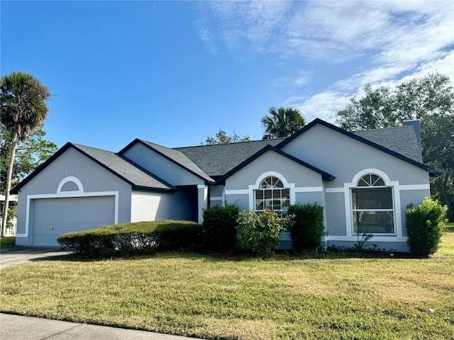 215 Hollowbrook Cir, Daytona Beach, FL 32114 - ranch-style house with an attached garage, a front yard, stucco siding, a shingled roof, and concrete driveway