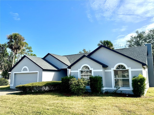 215 Hollowbrook Cir, Daytona Beach, FL 32114 - ranch-style house with a shingled roof, a garage, a front lawn, and stucco siding