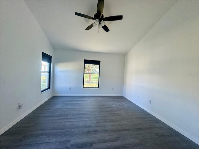 215 Hollowbrook Cir, Daytona Beach, FL 32114 - spare room featuring lofted ceiling, a ceiling fan, baseboards, and dark wood-style flooring