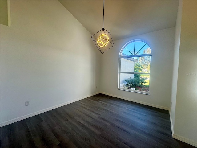 215 Hollowbrook Cir, Daytona Beach, FL 32114 - unfurnished room with dark wood finished floors, vaulted ceiling, and baseboards