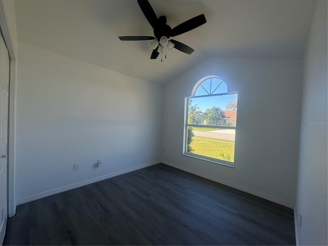 215 Hollowbrook Cir, Daytona Beach, FL 32114 - spare room with lofted ceiling, dark wood-style floors, ceiling fan, and baseboards