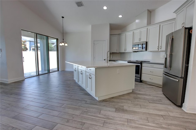 1727 Butterfly Way, Longwood, FL 32750 - kitchen with appliances with stainless steel finishes, light wood finished floors, baseboards, a sink, and recessed lighting
