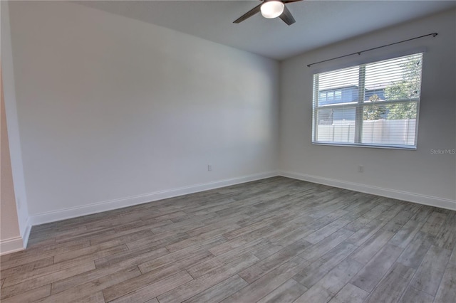 1727 Butterfly Way, Longwood, FL 32750 - unfurnished room with a ceiling fan, wood finished floors, and baseboards