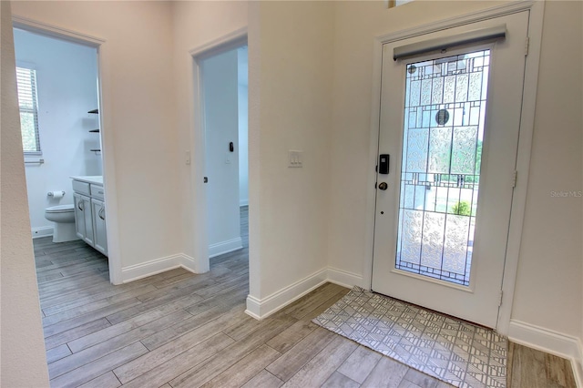 1727 Butterfly Way, Longwood, FL 32750 - entrance foyer with light wood finished floors and baseboards
