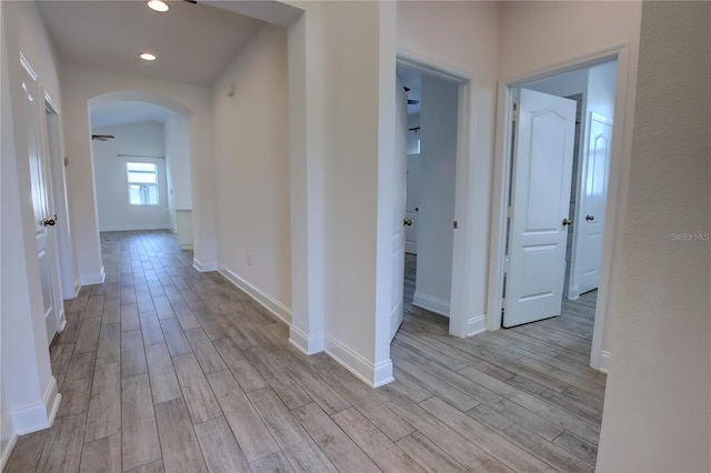 1727 Butterfly Way, Longwood, FL 32750 - corridor featuring arched walkways, light wood-style flooring, recessed lighting, and baseboards
