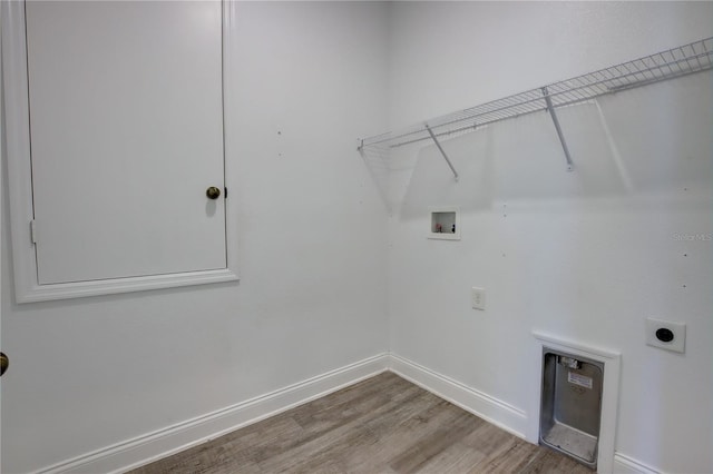1727 Butterfly Way, Longwood, FL 32750 - laundry room with electric dryer hookup, hookup for a washing machine, wood finished floors, and baseboards