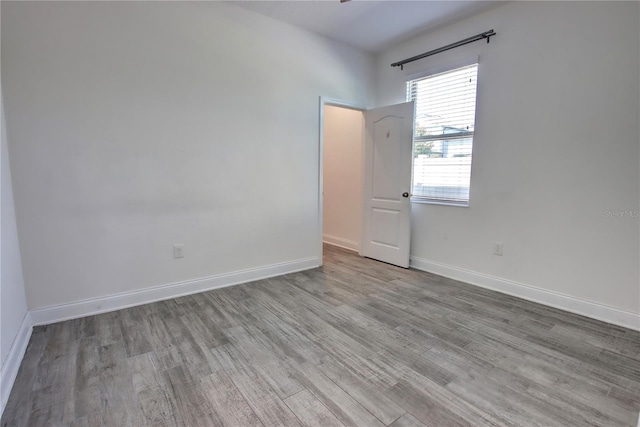 1727 Butterfly Way, Longwood, FL 32750 - spare room featuring wood finished floors and baseboards
