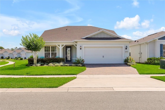 2793 Nature View Rd, Saint Cloud, FL 34771 - single story home featuring decorative driveway, a front yard, stucco siding, and an attached garage
