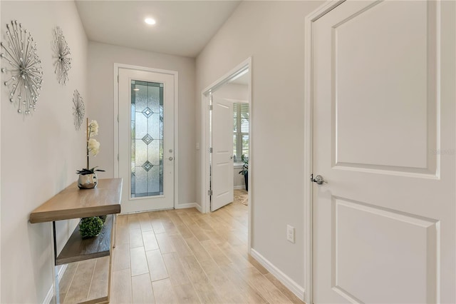 2793 Nature View Rd, Saint Cloud, FL 34771 - foyer entrance featuring baseboards, light wood finished floors, and recessed lighting