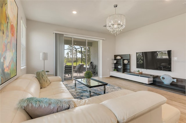 2793 Nature View Rd, Saint Cloud, FL 34771 - living area with wood finished floors, a chandelier, recessed lighting, and baseboards
