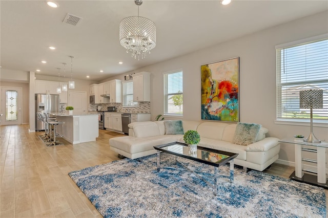 2793 Nature View Rd, Saint Cloud, FL 34771 - living area with healthy amount of natural light, light wood-style flooring, recessed lighting, a chandelier, and baseboards