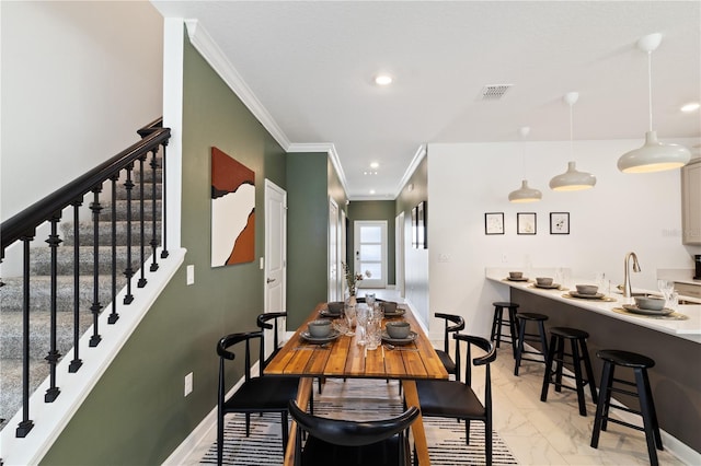 4184 Paragraph Dr, Kissimmee, FL 34746 - dining space featuring crown molding, light marble finish floors, stairway, recessed lighting, and baseboards