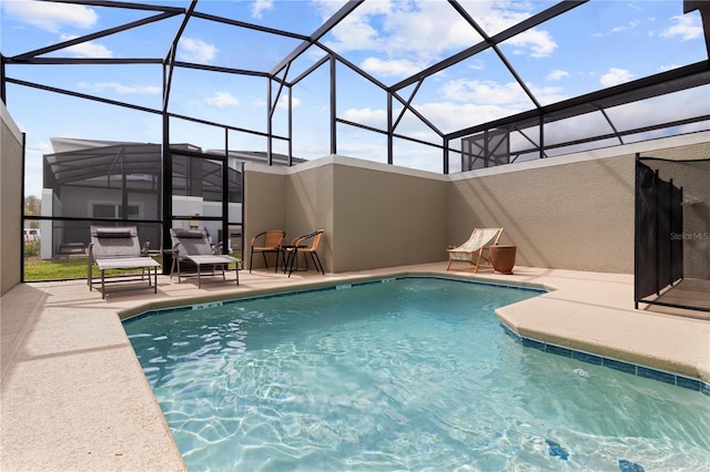 4184 Paragraph Dr, Kissimmee, FL 34746 - outdoor pool featuring a patio and glass enclosure