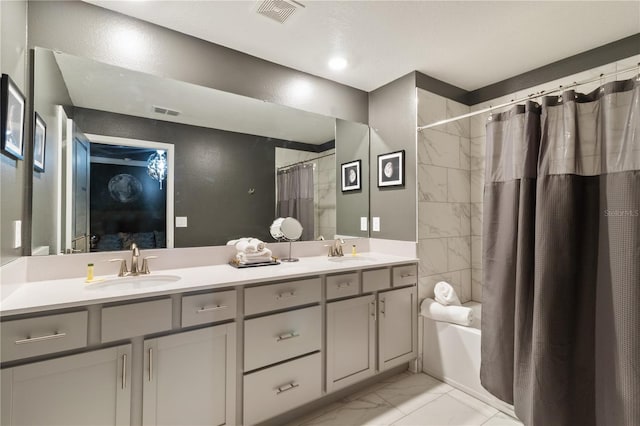 4184 Paragraph Dr, Kissimmee, FL 34746 - bathroom with marble finish flooring, double vanity, and shower / bath combo