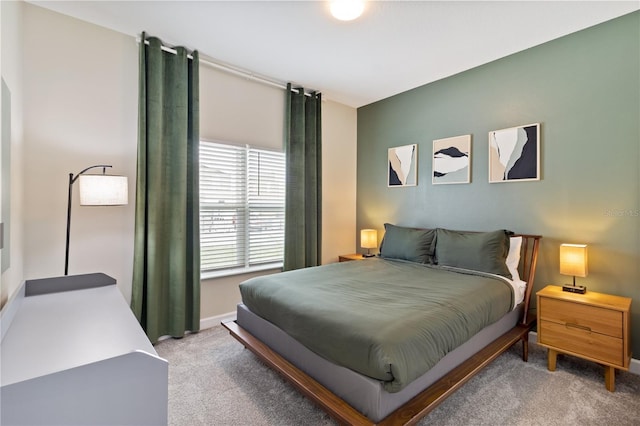 4184 Paragraph Dr, Kissimmee, FL 34746 - bedroom featuring light carpet and baseboards