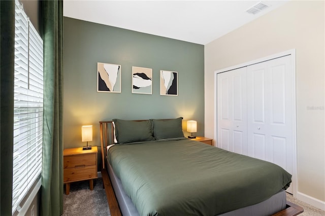 4184 Paragraph Dr, Kissimmee, FL 34746 - bedroom featuring dark colored carpet, a closet, and baseboards