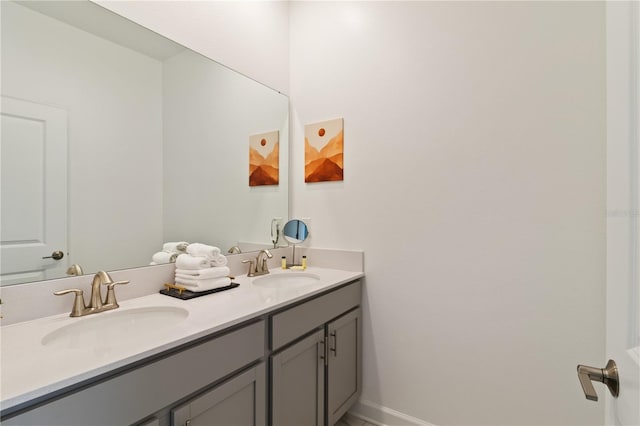 4184 Paragraph Dr, Kissimmee, FL 34746 - bathroom featuring double vanity and baseboards