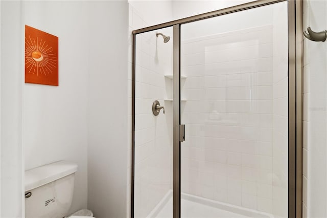 4184 Paragraph Dr, Kissimmee, FL 34746 - bathroom featuring a shower stall and toilet