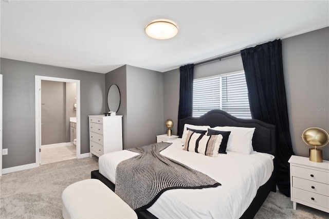 4184 Paragraph Dr, Kissimmee, FL 34746 - carpeted bedroom with baseboards and connected bathroom