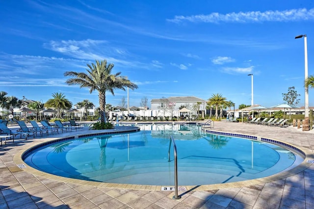 4184 Paragraph Dr, Kissimmee, FL 34746 - community pool featuring a patio area