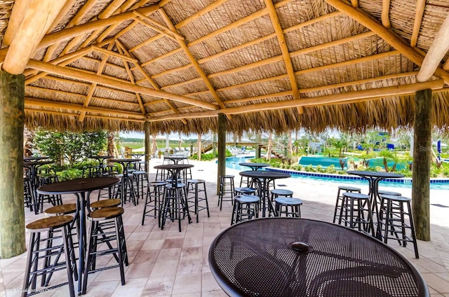4184 Paragraph Dr, Kissimmee, FL 34746 - view of patio featuring a gazebo, an outdoor pool, and exterior bar