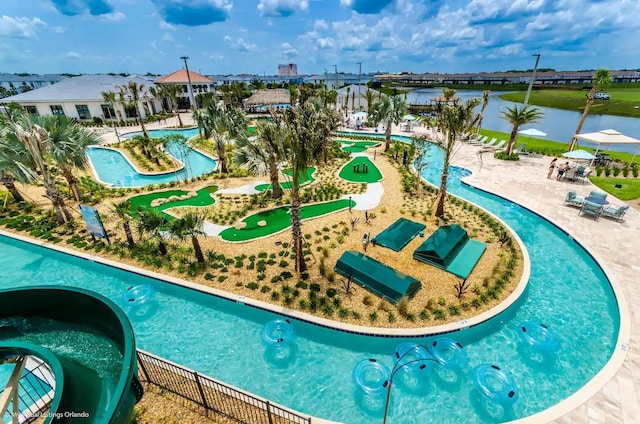 4184 Paragraph Dr, Kissimmee, FL 34746 - view of pool featuring an area to practice putting and a water view