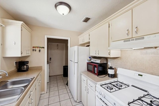 2822 Fulford St, Deltona, FL 32738 - kitchen featuring white appliances, under cabinet range hood, light countertops, decorative backsplash, and light tile patterned flooring