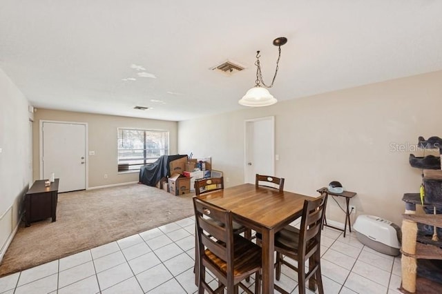 2822 Fulford St, Deltona, FL 32738 - dining area with light colored carpet and light tile patterned flooring