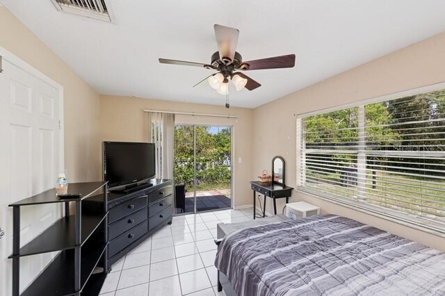 2822 Fulford St, Deltona, FL 32738 - bedroom featuring access to exterior, light tile patterned flooring, and a ceiling fan