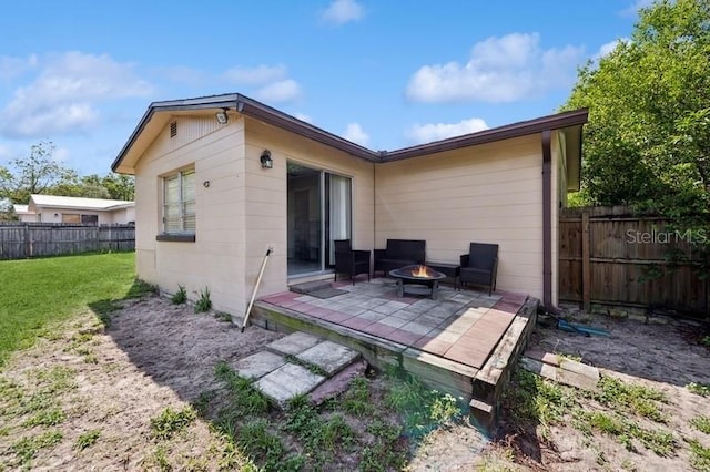 2822 Fulford St, Deltona, FL 32738 - back of property with a fire pit, a patio, and a fenced backyard