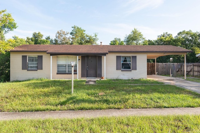 2822 Fulford St, Deltona, FL 32738 - ranch-style house featuring concrete block siding, an attached carport, and driveway