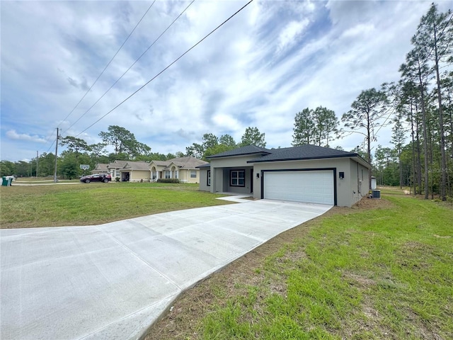 628 W Heronsbill Ln, Dunnellon, FL 34434 - view of front of house with concrete driveway, an attached garage, stucco siding, and a front yard
