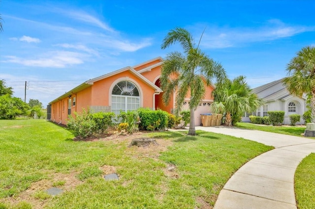2627 Autumn Creek Cir, Kissimmee, FL 34747 - view of front facade with stucco siding, concrete driveway, and a front lawn