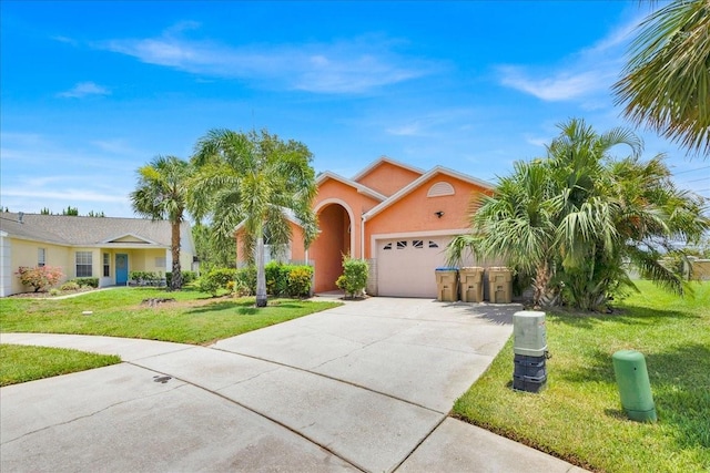 2627 Autumn Creek Cir, Kissimmee, FL 34747 - view of front of house featuring concrete driveway, an attached garage, a front yard, and stucco siding